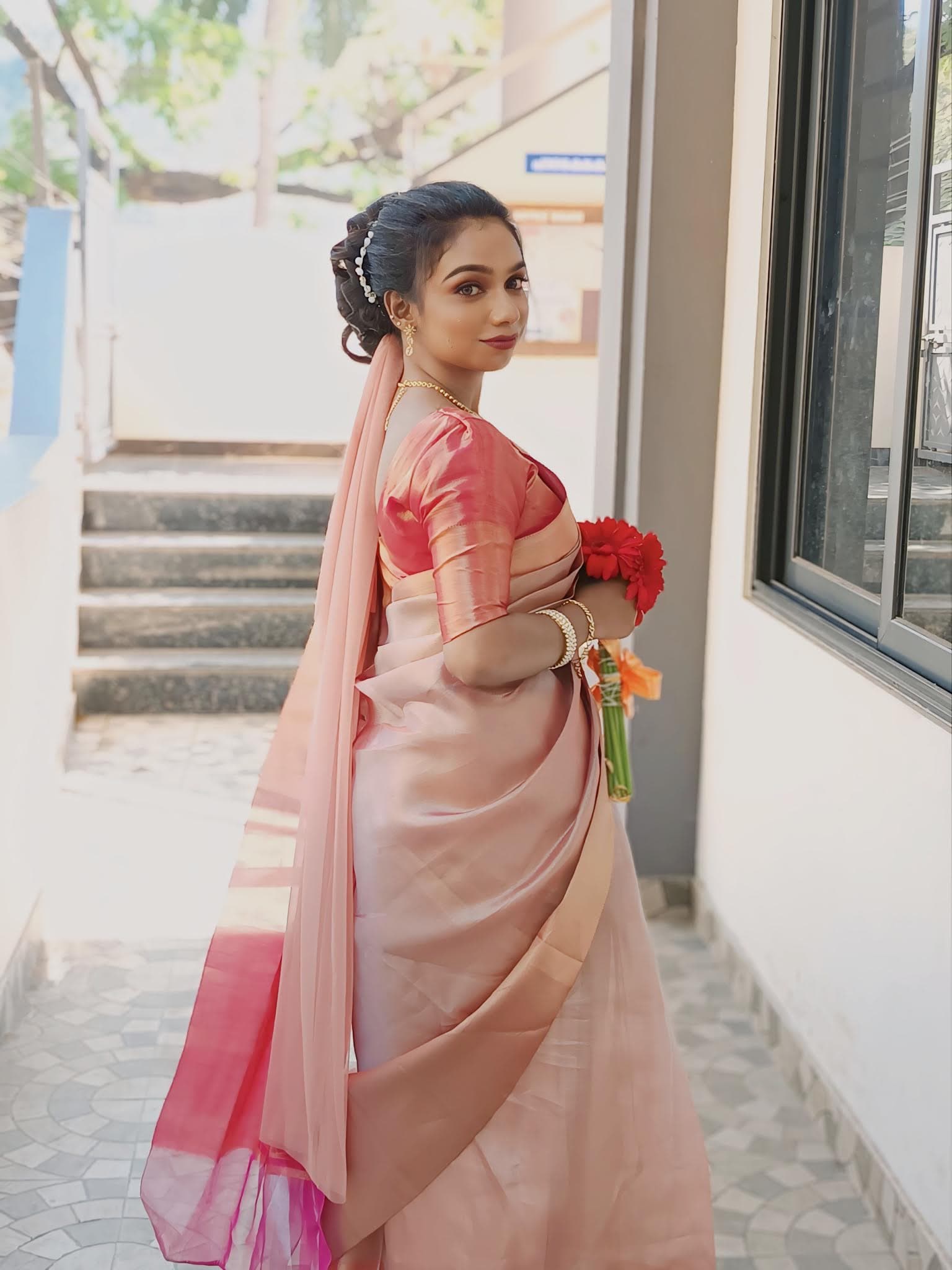 Christian girl in an elegantly draped saree